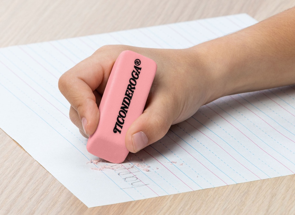 Child's hand with a Ticonderoga eraser